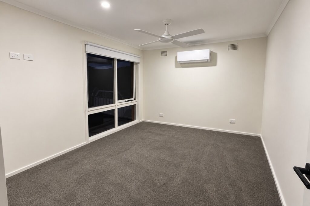 Bedroom with a new ceiling fan and LED downlights