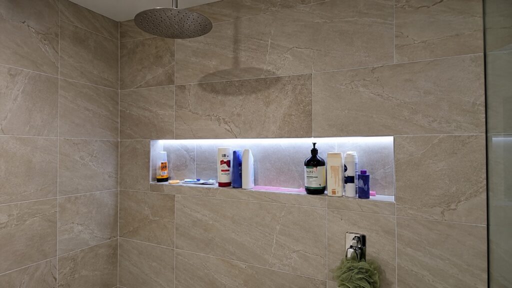 Shower niche lit with an LED strip