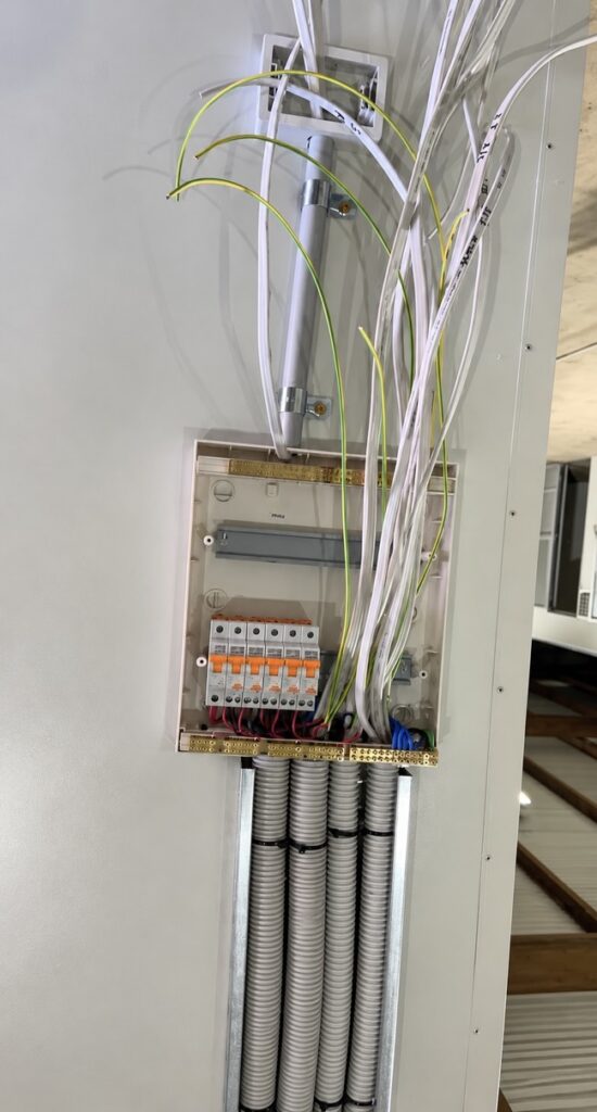 Distribution board being wired during a fit-out