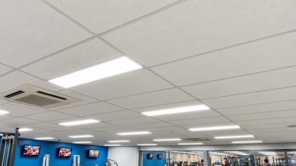 Commercial space with LED panel lighting across a suspended ceiling