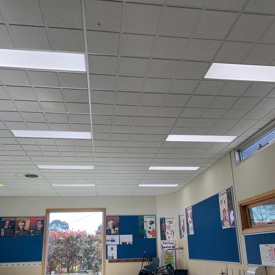 Classroom with rows of LED panel lights