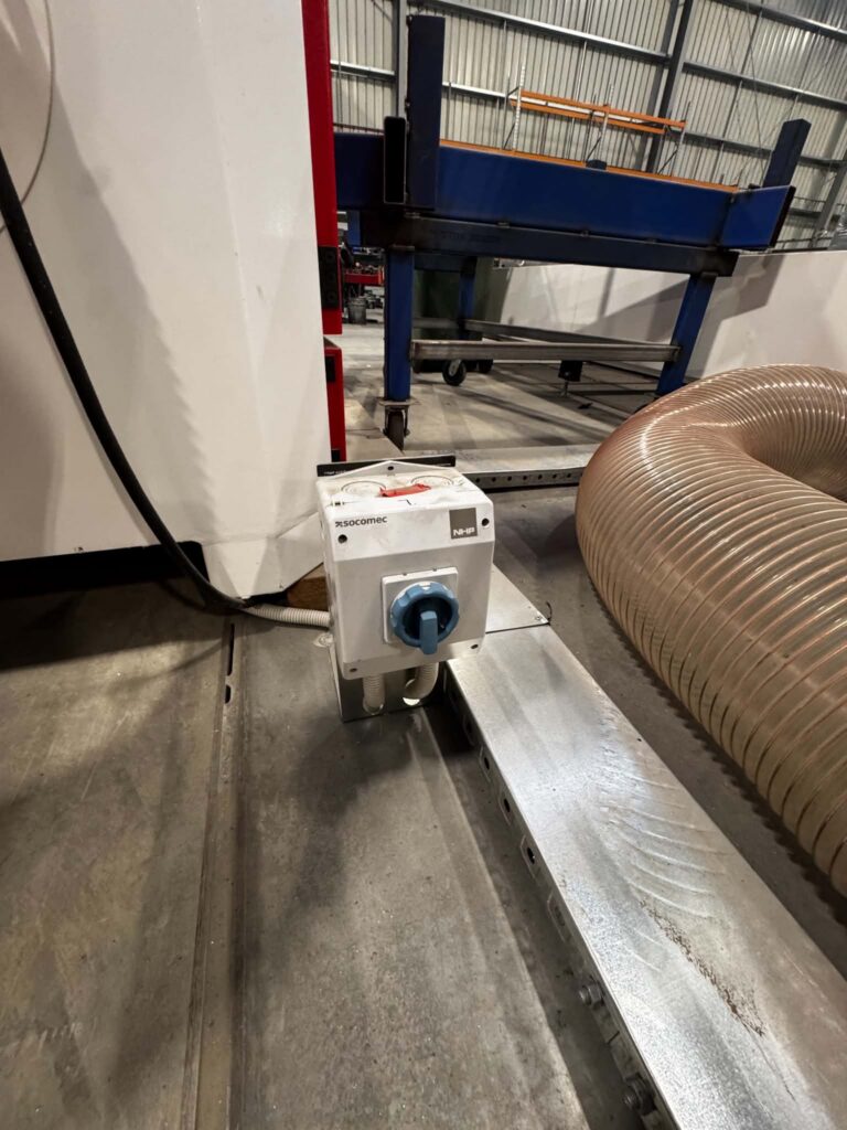 Rotary isolator switch mounted on industrial machinery