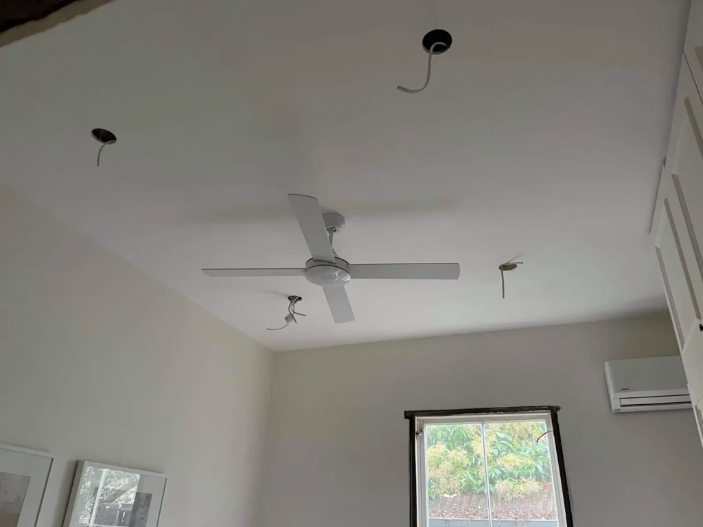 Ceiling fan and LED downlights installed in a living room