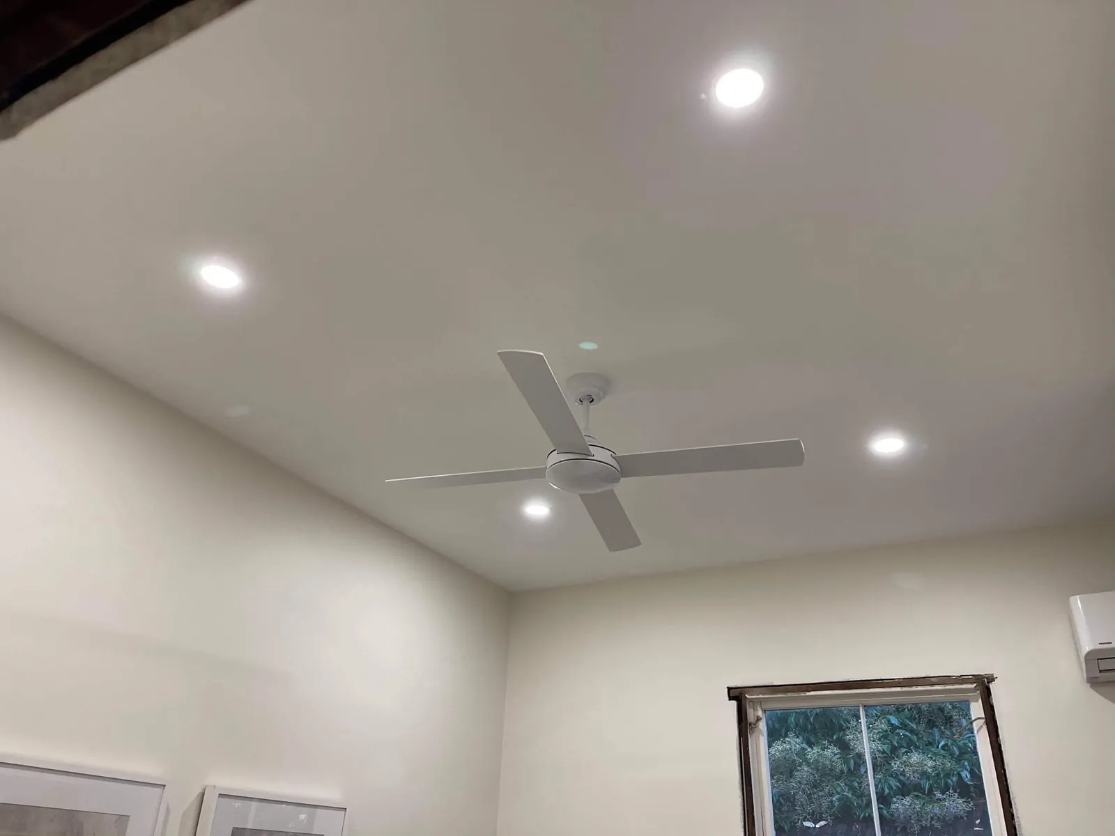 White ceiling fan with LED downlights switched on