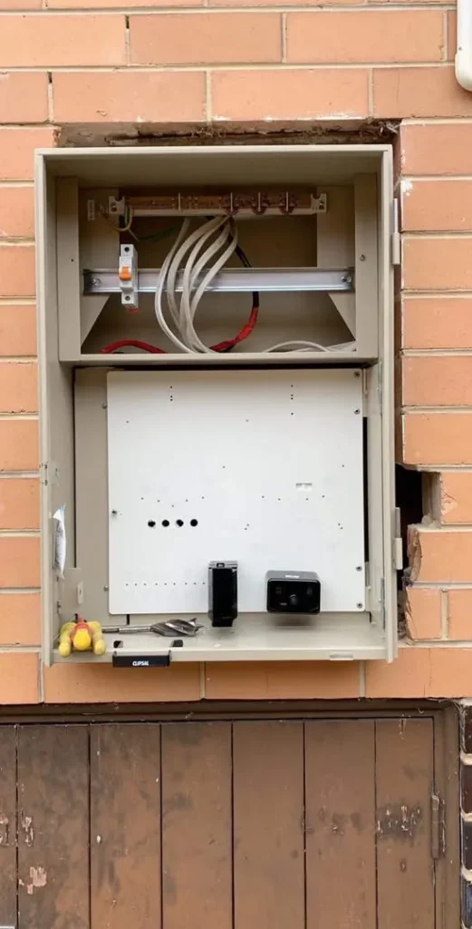 Older meter box opened before an electrical upgrade