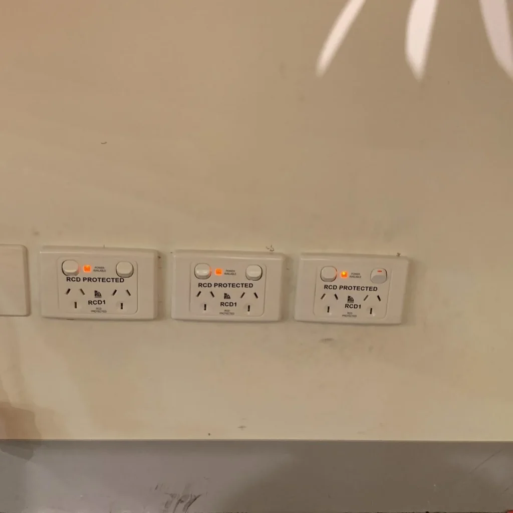 Row of new double power points installed on a wall