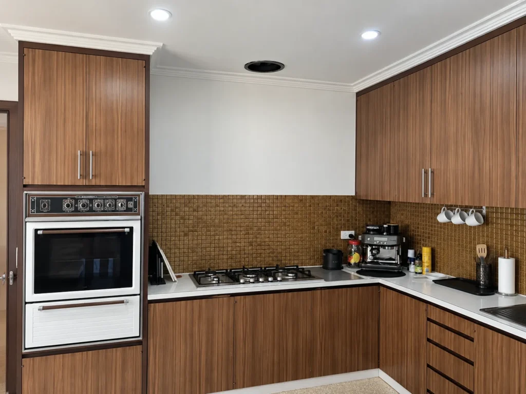 Kitchen cooktop area with the rangehood ducting outlet fitted in the ceiling